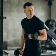 A man with two dumbbell